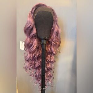 Brand new 36 inch 13x6 synthetic wig. Dusty mauve bouncy curls